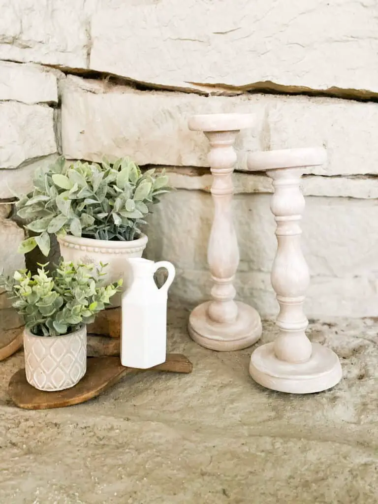 Want some modern farmhouse style, bleached wood candle holders without having to go through the whole sanding, stripping, and staining process? Find out how I turned these upcycled candle holders which were super dark stained, into these gorgeous faux bleached wood candle holders using only paint!