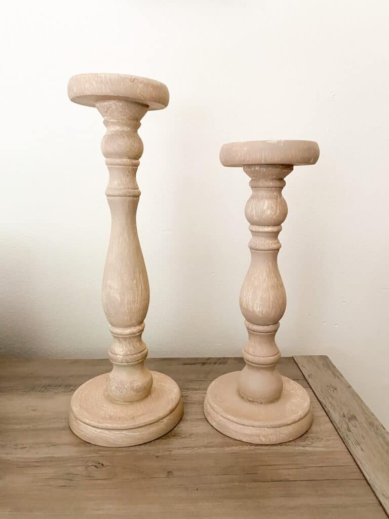 Want some modern farmhouse style, bleached wood candle holders without having to go through the whole sanding, stripping, and staining process? Find out how I turned these upcycled candle holders which were super dark stained, into these gorgeous faux bleached wood candle holders using only paint!