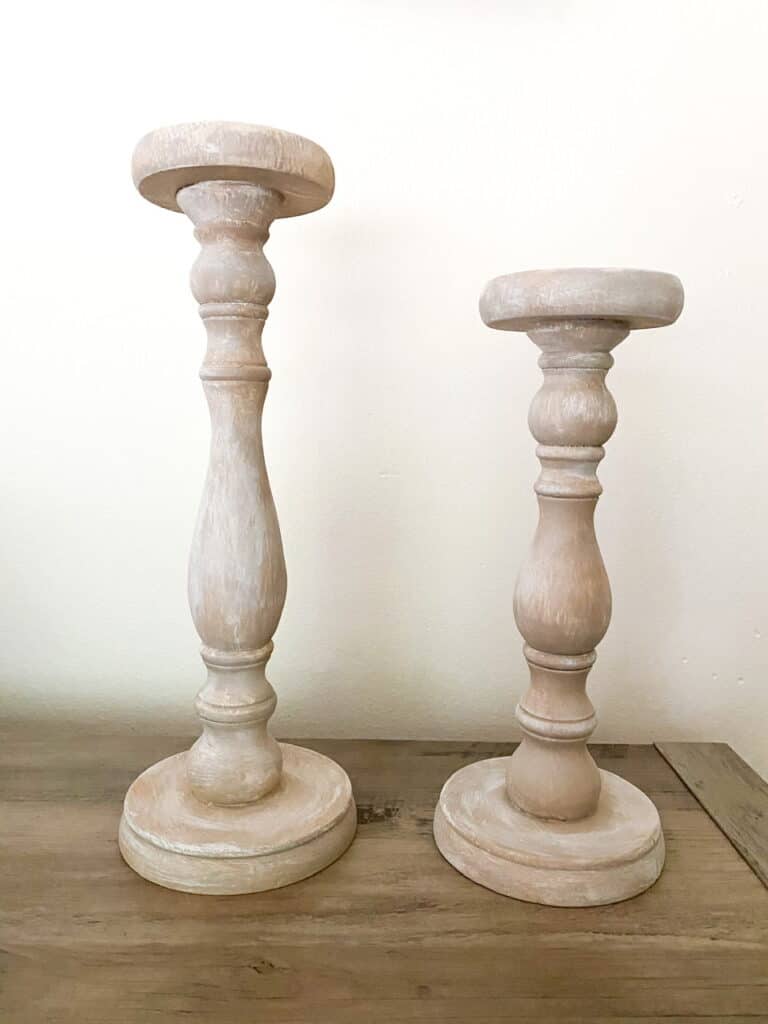 Want some modern farmhouse style, bleached wood candle holders without having to go through the whole sanding, stripping, and staining process? Find out how I turned these upcycled candle holders which were super dark stained, into these gorgeous faux bleached wood candle holders using only paint!