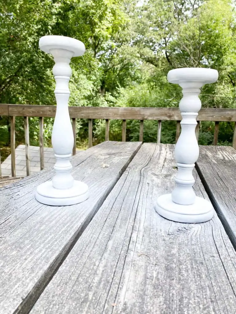 Want some modern farmhouse style, bleached wood candle holders without having to go through the whole sanding, stripping, and staining process? Find out how I turned these upcycled candle holders which were super dark stained, into these gorgeous faux bleached wood candle holders using only paint!