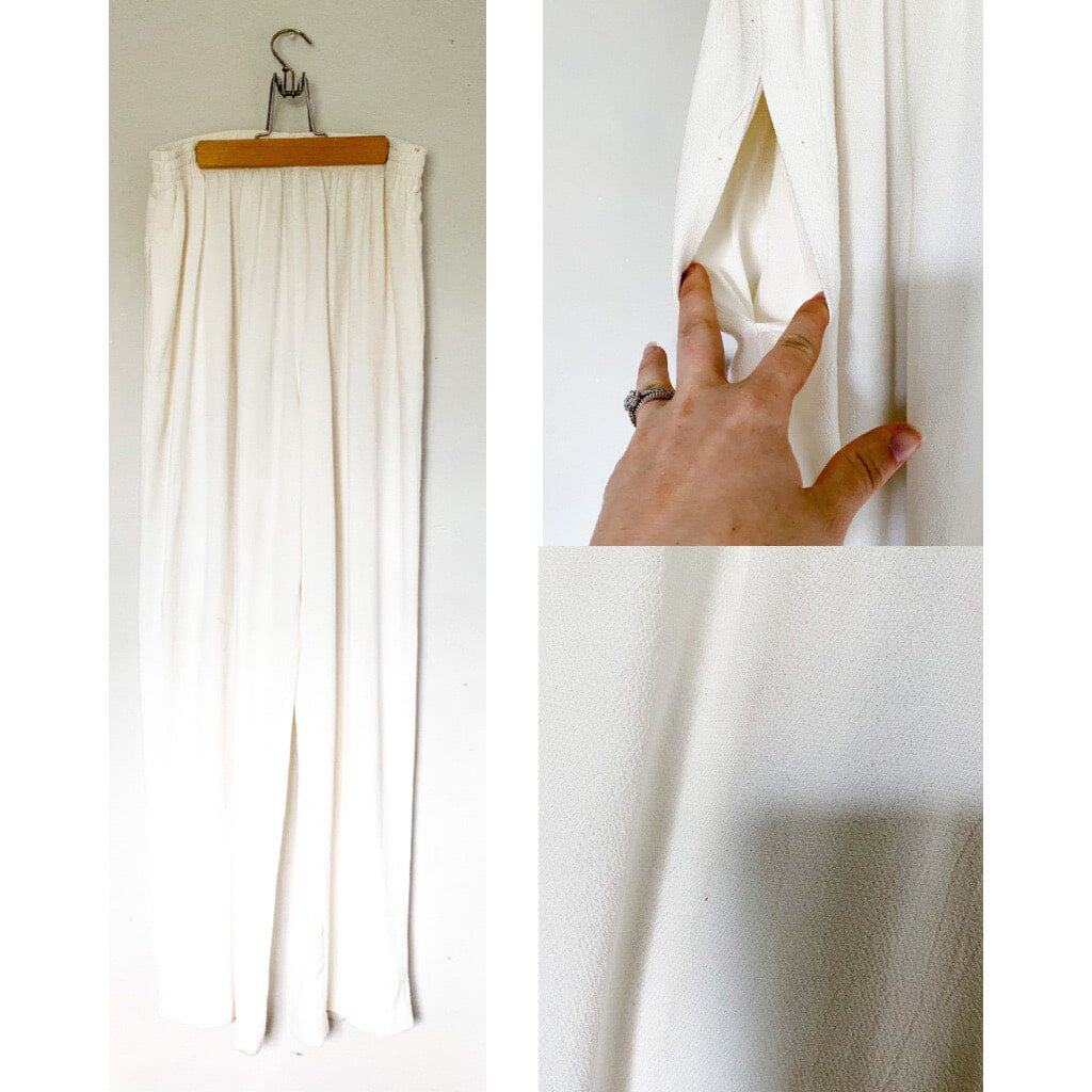 Cream high waisted trousers that have an elastic waistband and wide legs.