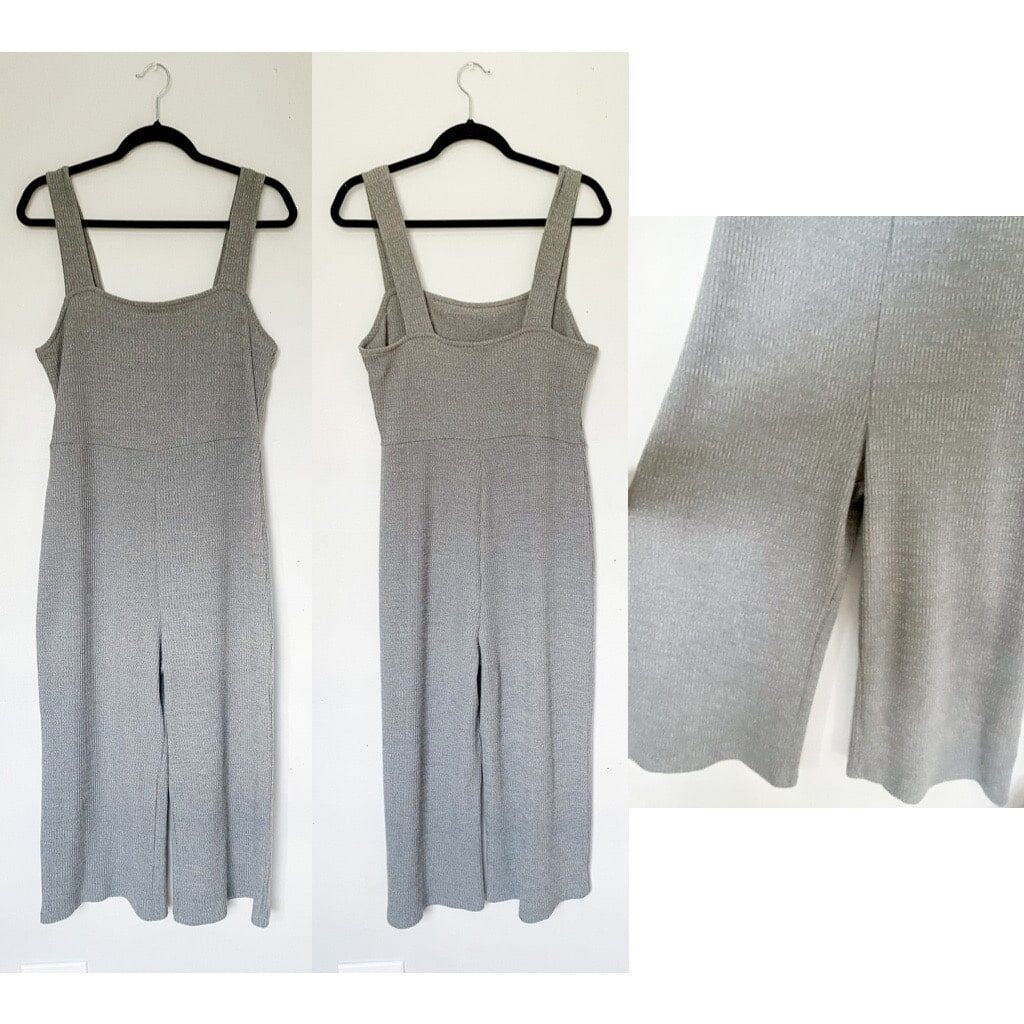 A gray ribbed jumpsuit that has cropped wide legs.