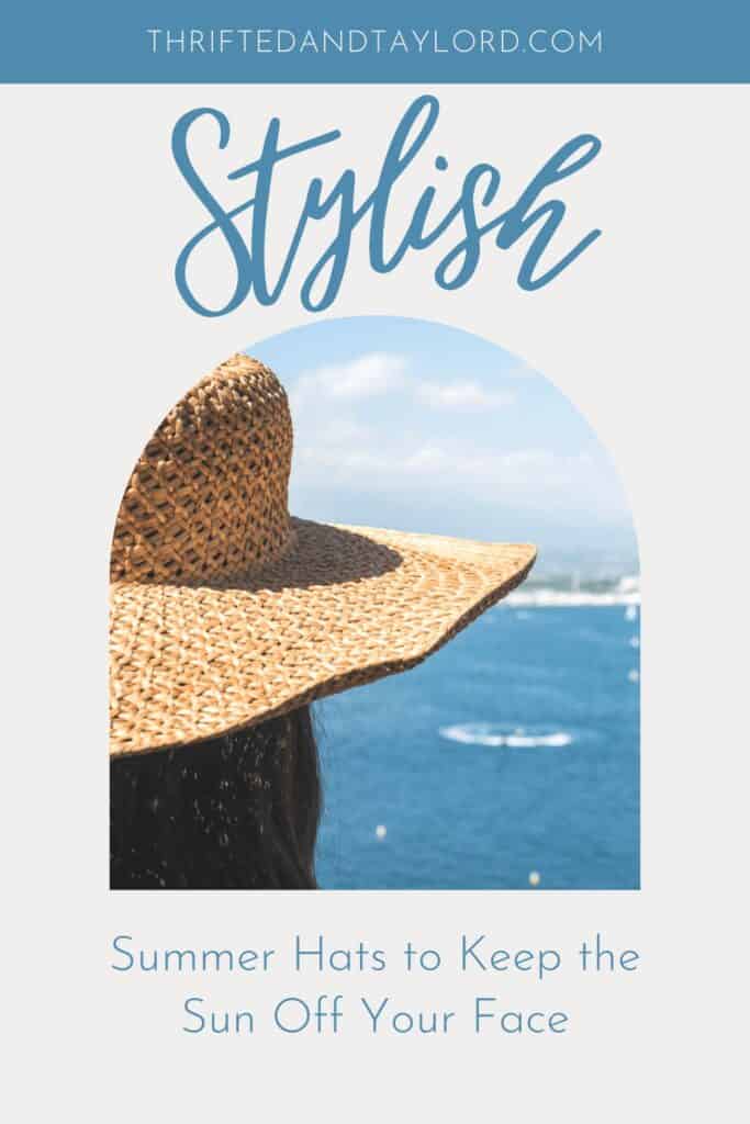 A woman wearing a straw hat looking out over a body of water with boats.