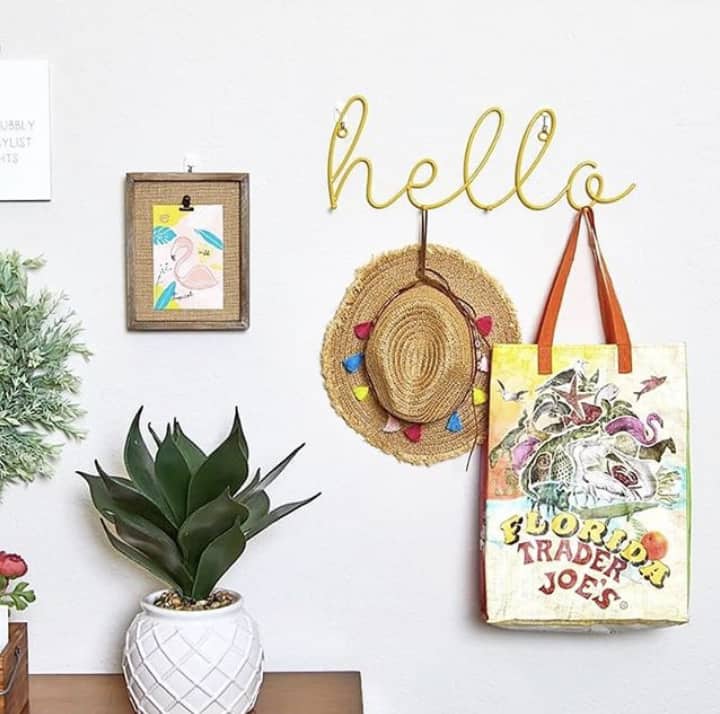 This yellow hello wall hook sign which is one of the items you will receive in your summer subscription box.