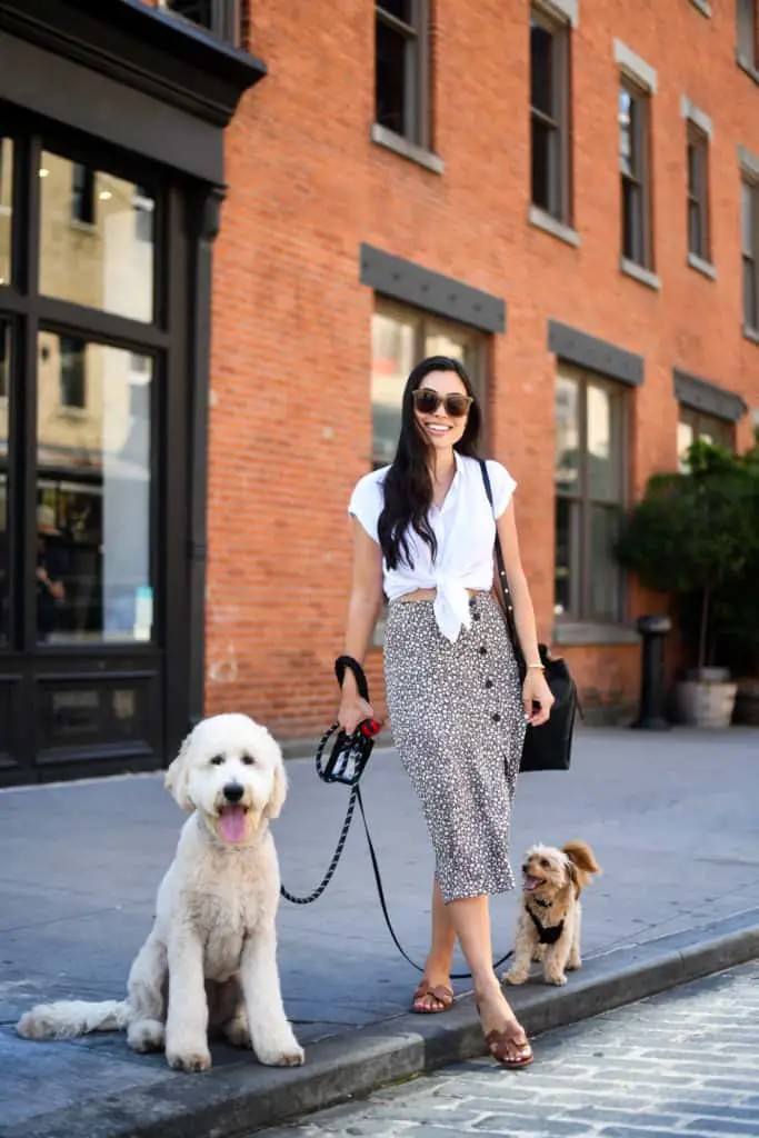 How to style a button down shirt. Wear it with a skirt and tie up the bottom of the shirt.