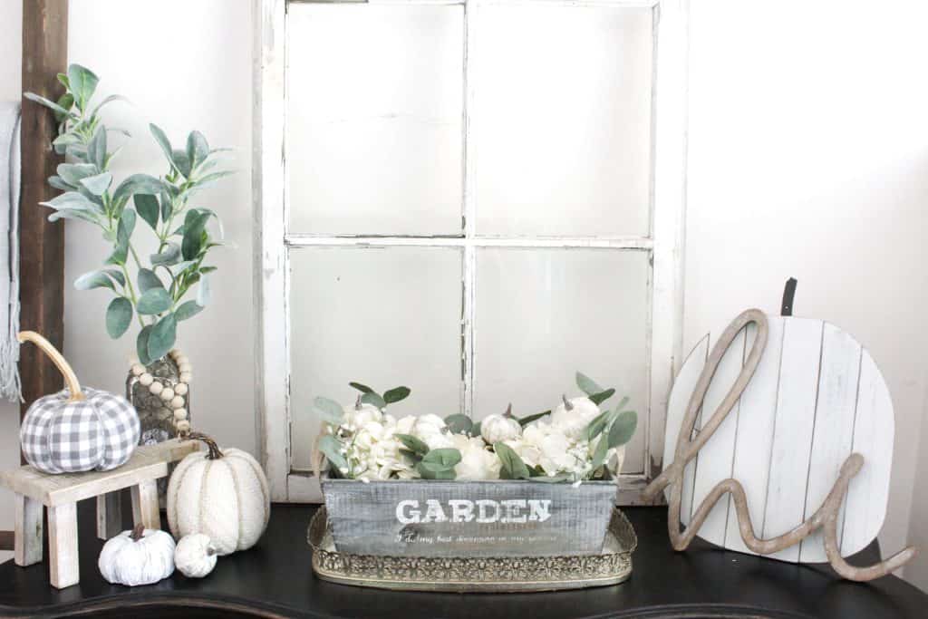 A great entryway table full of neutral fall decor.