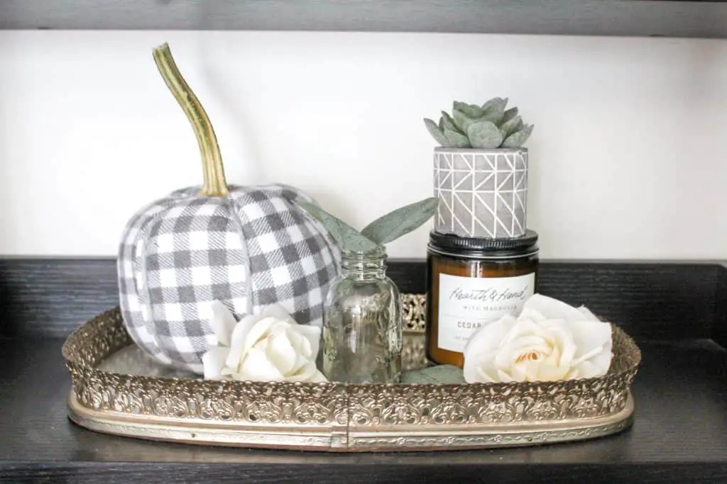 Neutral fall decor | A collection of fall items on a mirrored tray.