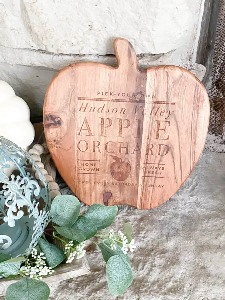 Neutral fall decor, a wooden apple orchard sign in the shape of an apple.