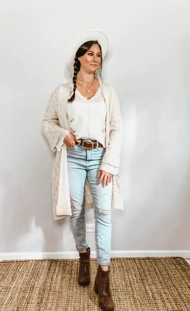 These thrifted fall basics are perfect for all your casual fall outfits. This cream sheer button down blouse with pink and green floral embroidery pairs perfectly with these high rise light wash jeans, a cream hat, a brown belt, and some brown ankle booties. Toss a cardigan over top for that cooler fall weather.