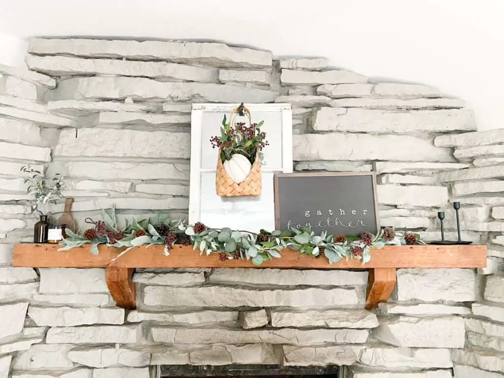 Fireplace mantle with muted fall decor. The perfect way to add some color to your neutral fall decor