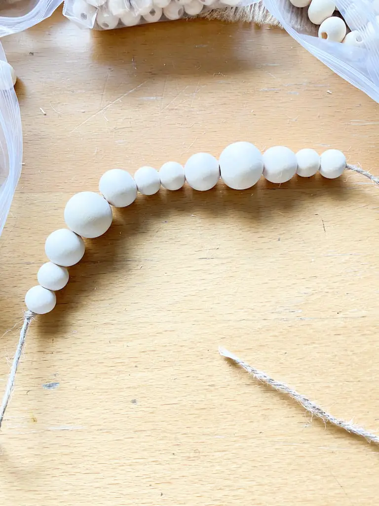 The pattern I used for my wood bead garland was small, small, medium, large, medium, small, small.