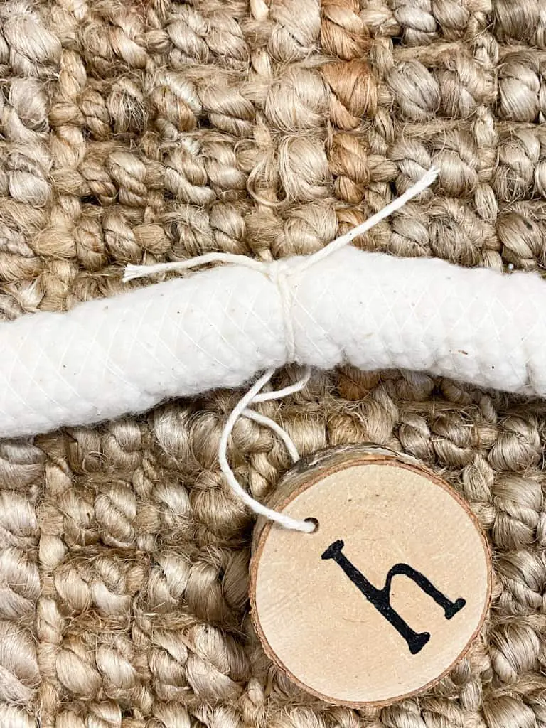 wood slice tied to cotton cording.