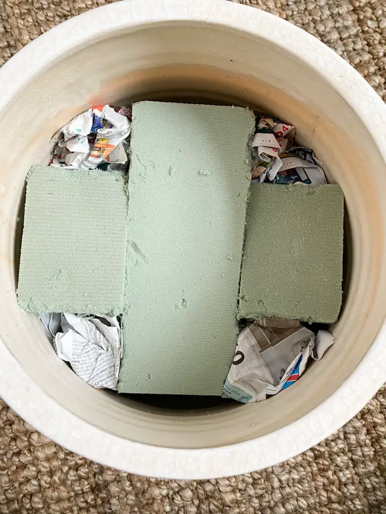The inside of the pot after I filled in the holes with recycled newspapers.