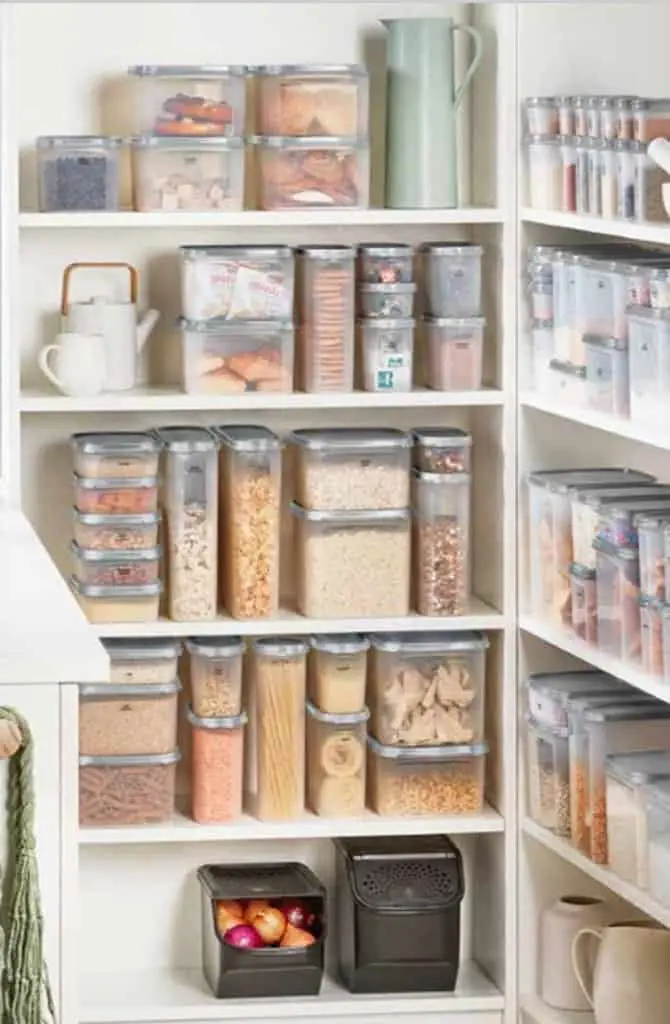An organized pantry using the Tupperware Modular mates, another must have Tupperware product. They come in several heights and sizes and they are clear with a black lid.