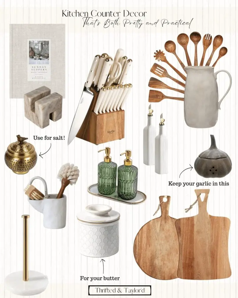An assortment of kitchen decor such as a cookbook with a stone book holder, a wood knife block with cream and gold handed knives, a ceramic vintage inspired pitcher with some wooden cooking spoons and utensils. There is a small brass bowl with a lid that can be used for sale, another black one that you can use for garlic, there is a set of oil dispenser bottles that are white with gold pour spouts, a set of 2 green glass soap dispensers with gold pumps that are sitting on a white ceramic tray that has a gold boarder. There is a paper towel holder than has a stone base and a gold metal rod to hold them. There is a vintage inspired ceramic dish brush holder, a white etched pattern ceramic butter keeper, and 2 wood cutting board; one is round and the other is more of a square with curved sides.