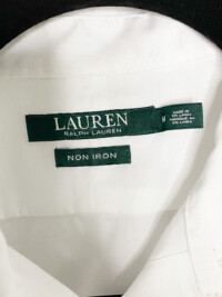 Close up of the tag for the white collared button down Ralph Lauren shirt.