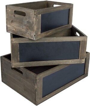 Wooden crates with chalkboard signs for pantry organization.