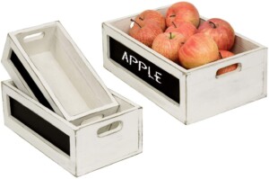 Wooden crates with chalkboard signs for pantry organization.