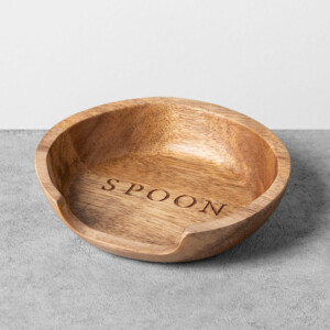 A wooden kitchen spoon holder with the word spoon engraved in the center. The perfect gift for someone who loves to cook.