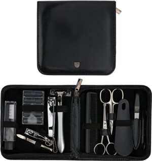 A travel sized grooming kit for men in a black leather case.