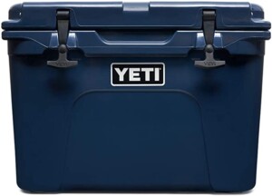 A large navy blue Yeti cooler.
