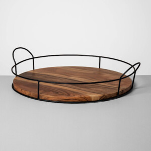 A black metal and wood serving tray. The perfect gift for someone who loves to decorate their home.