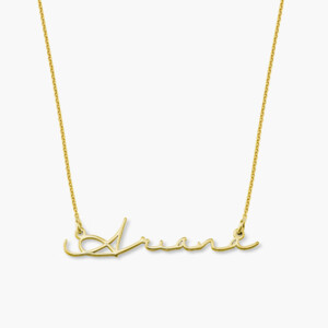A gold necklace with the name Ariana in cursive. A great holiday gift for her.