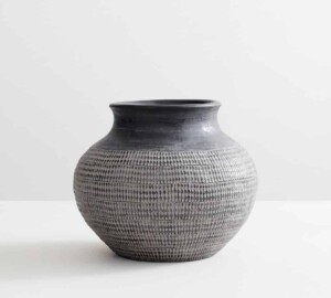 A black textured aged vase
